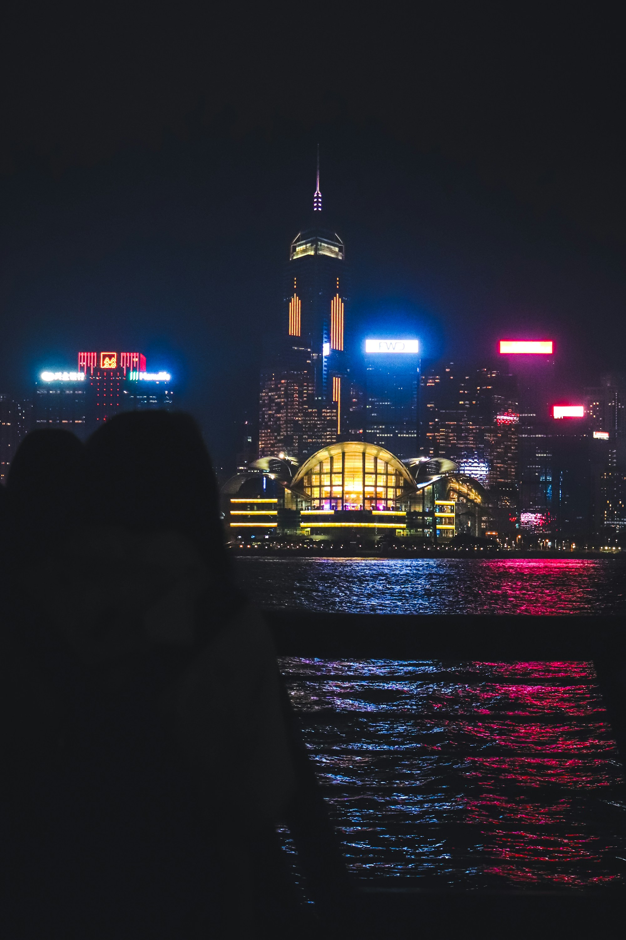 Hong Kong skyline reflected over the harbour at night